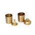 Set of brass containers and accessories on a white background