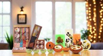 Collection of candles and decorative items on a table with a blurred indoor background