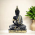 Decorative Buddha statue with intricate patterns on a beige background