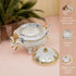 Decorative elephant-shaped container with opulent bowl and elegant silver crystals on a pink surface.