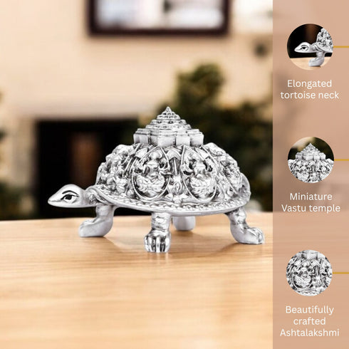 Decorative tortoise with miniature temple on a wooden surface, featuring text about its design elements.