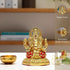 Gold-colored deity statue with additional details on a neutral background