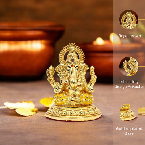 Gold-colored deity statue with close-up details on a wooden surface