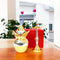 Gold and silver hookah set on a wooden table with a blurred indoor background