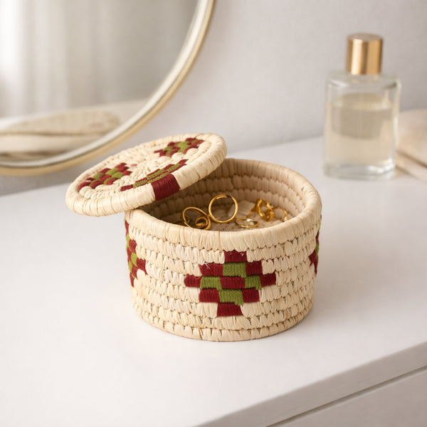 Woven jewelry box with a geometric pattern on a white surface