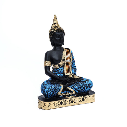 Decorative Buddha statue with black, blue, and gold colors on a white background