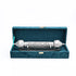 Decorative silver rod with intricate patterns in a teal box on a white background
