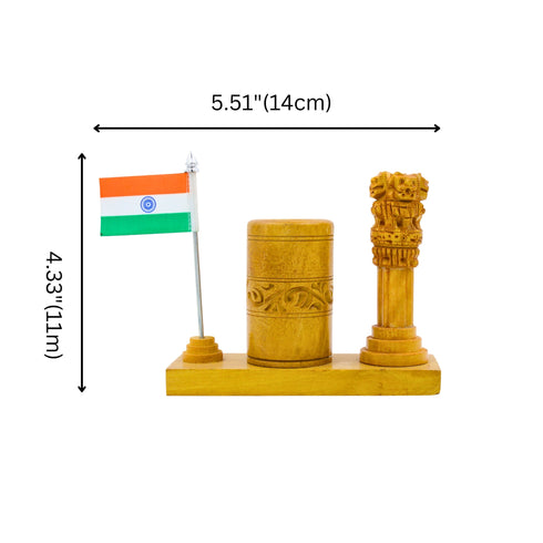 Wooden pen stand with carved Ashoka Stambh and miniature Indian flag on office desk