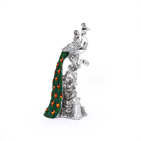 Silver-plated Peacock sitting on the branch