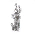 Silver-plated Peacock sitting on the branch