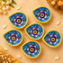 Hand-Painted Blue Pottery Diya with Floral Motif on Yellow Base