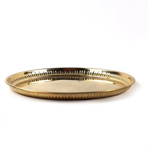 A round brass serving tray with a fluted rim, photographed on a clean white background.