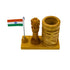 Close-up of rupee symbol and Ashoka Stambh carving on wooden pen stand
