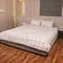 Folded Autumn Vine Pattern Handcrafted Bedcover highlighting soft fabric, detailed vine motifs, and handcrafted quality.