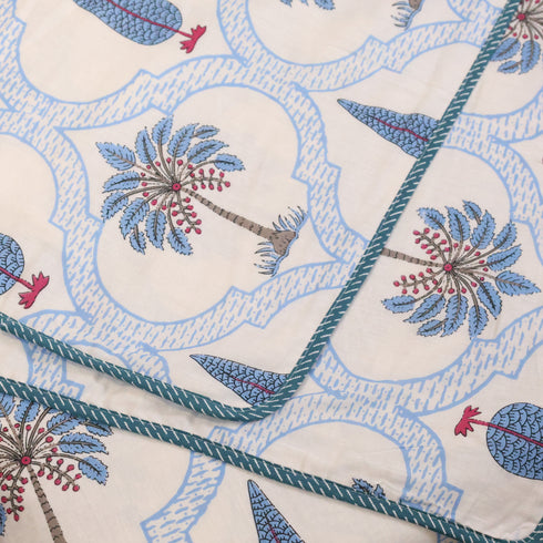 Handcrafted Blue Blooming Vines Lattice Cotton King Size Bedding Set styled on a bed, showcasing coordinated bedsheet, pillow covers, and dohar.