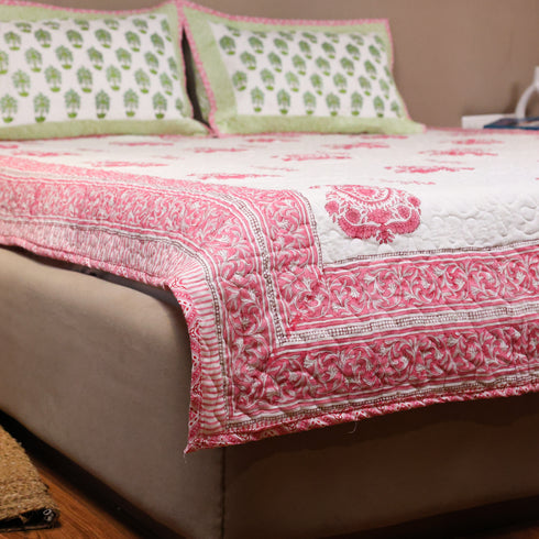 Hand Block Print Floral Pattern Premium Mulmul Cotton Bedcover and Pillow Cover styled on a double bed, showcasing timeless floral designs and handcrafted detailing.