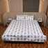 Folded Misty Blue Floral Pattern Bedcover highlighting premium fabric, soft texture, and intricate floral prints.