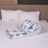 Folded Misty Blue Floral Pattern Comforter highlighting premium quilting, soft filling, and detailed floral artwork.