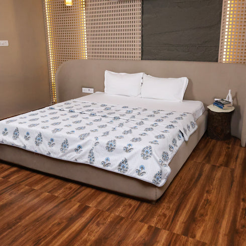 Close-up of Misty Blue Floral Pattern Double Bed Dohar showcasing soft cotton texture and detailed floral motifs.