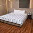Close-up of Misty Blue Floral Pattern Double Bed Dohar showcasing soft cotton texture and detailed floral motifs.