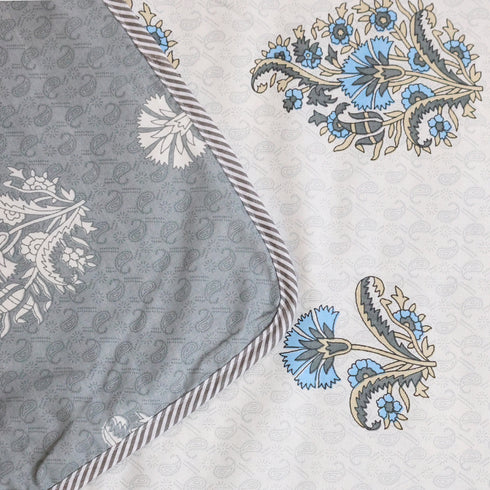 Misty Blue Floral Pattern Double Bed Dohar showcasing delicate floral artwork and handcrafted detailing.