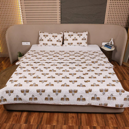 Regal Elephant Caravan Bedcover and Pillow Cover styled on a double bed, showcasing heritage-inspired elephant artwork and elegant craftsmanship.