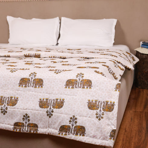 Regal Elephant Caravan Comforter styled on a double bed, showcasing heritage-inspired elephant artwork and luxurious comfort.