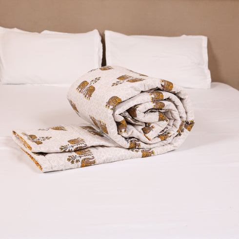 Close-up of Regal Elephant Caravan Comforter showcasing detailed elephant motifs, quilted stitching, and premium cotton texture.
