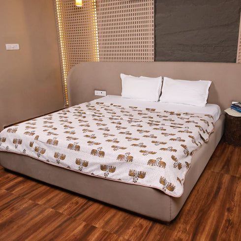 Folded Regal Elephant Caravan Handcrafted Dohar highlighting premium cotton fabric and elegant elephant caravan print.
