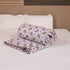 Folded Royal Elephant Bloom Double Bed Comforter highlighting premium quilting, soft filling, and intricate elephant floral prints.
