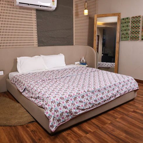Folded Royal Elephant Bloom Double Bed Dohar highlighting premium cotton fabric and detailed elephant floral patterns.