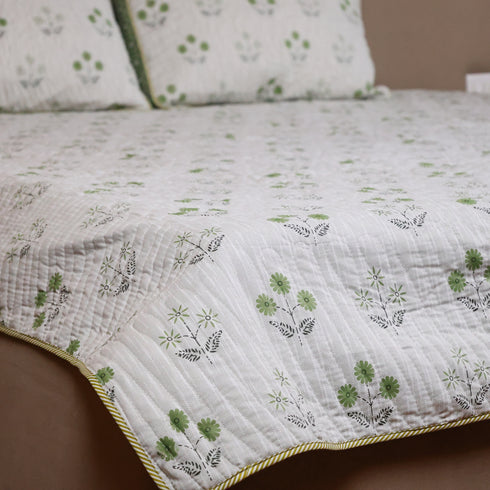 Vintage Olive Green Floral Bedcover and Pillow Cover styled on a double bed, showcasing timeless floral designs and premium craftsmanship.