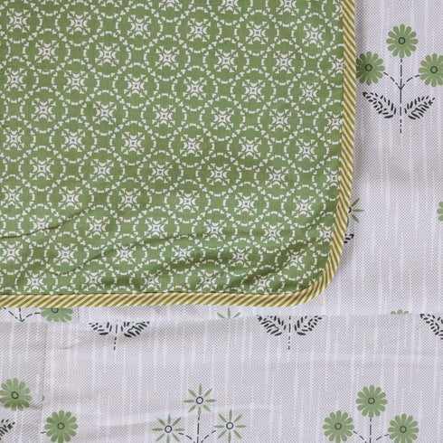 Folded Vintage Olive Green Floral Handcrafted Dohar highlighting premium cotton fabric and timeless floral patterns.