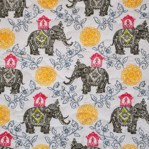 Yellow Blossom Elephant Bedcover and Pillow Cover styled on a bed, showcasing elegant handcrafted design and vibrant colors.