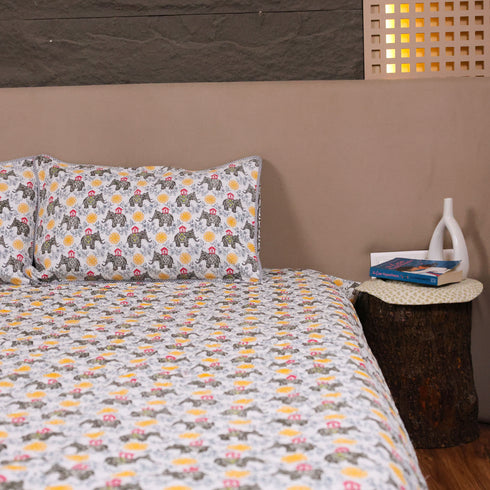 Folded Yellow Blossom Handcrafted Elephant Bedcover displaying premium fabric and intricate elephant print detailing.