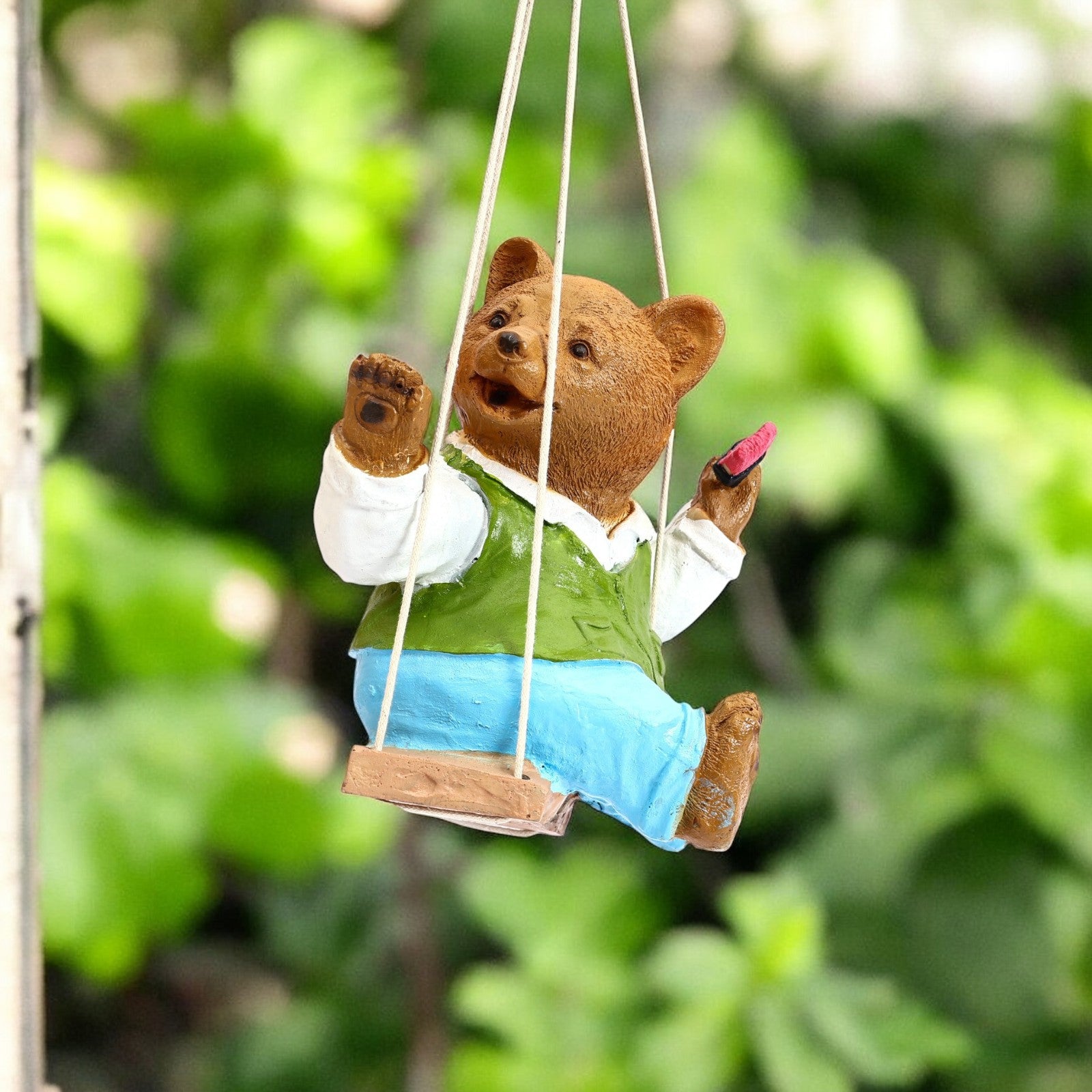 Adorable Hanging Teddy bear on a swing