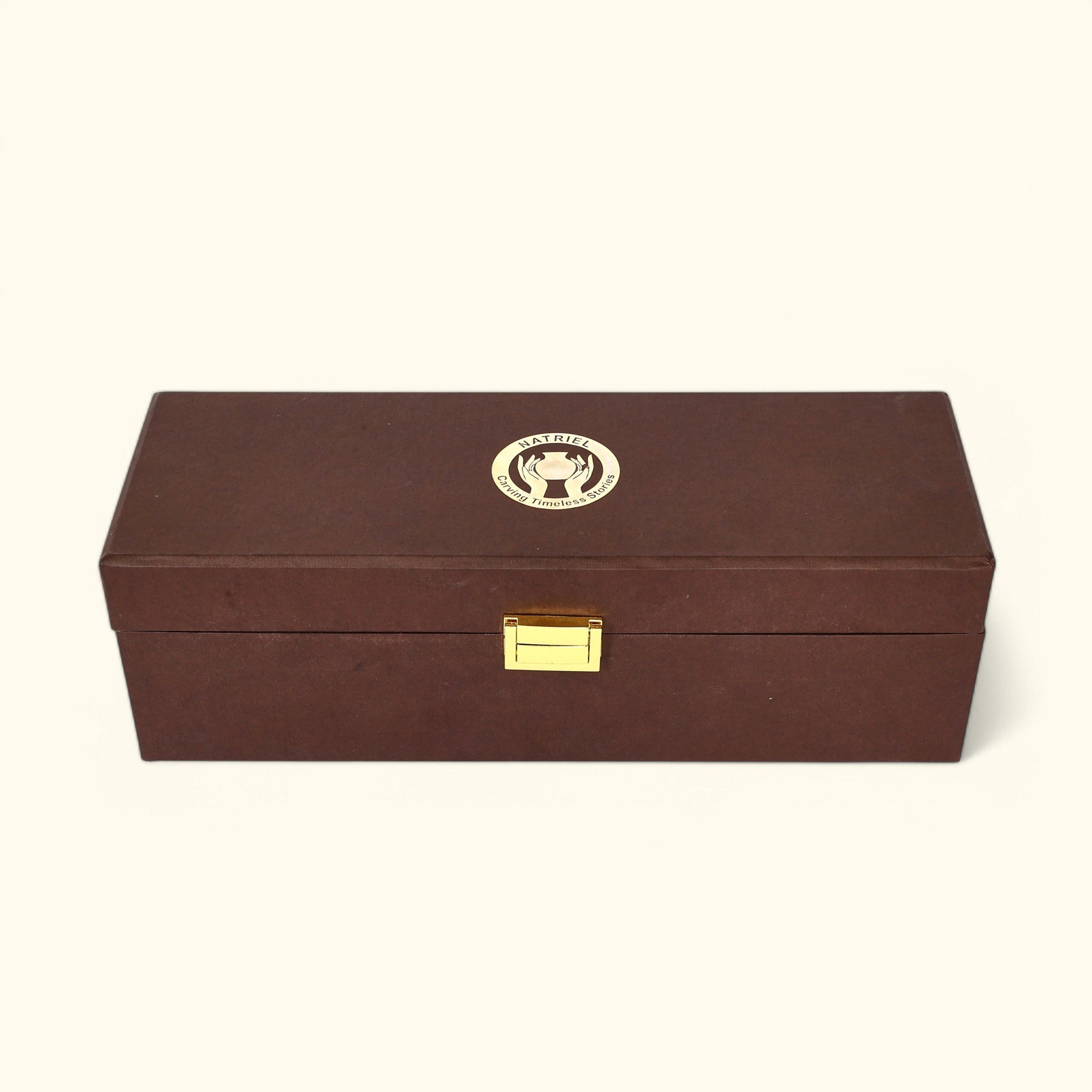 Brown wooden box with a gold clasp and emblem on a white background
