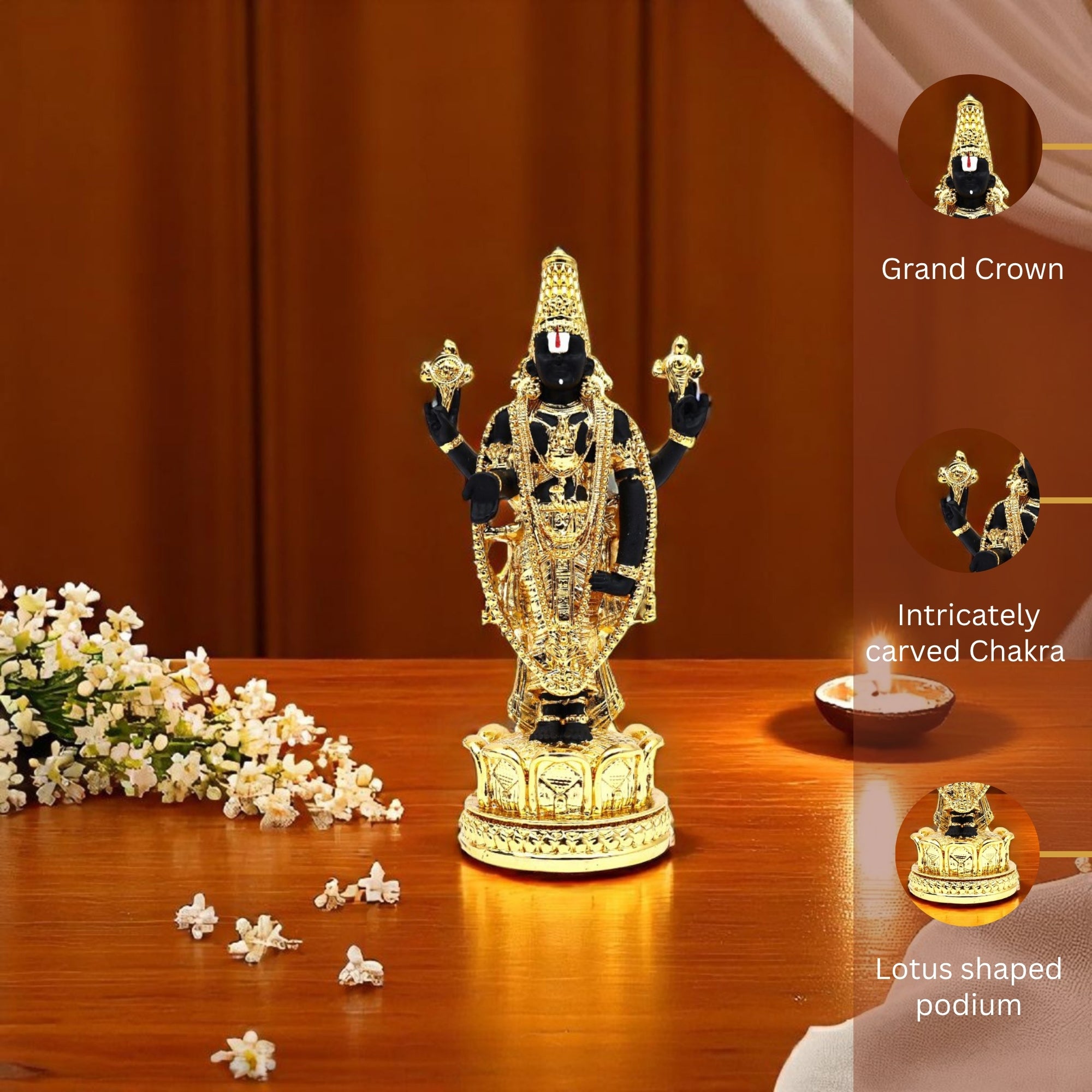 Decorative statue with intricate details on a wooden surface, surrounded by flowers and a candle.