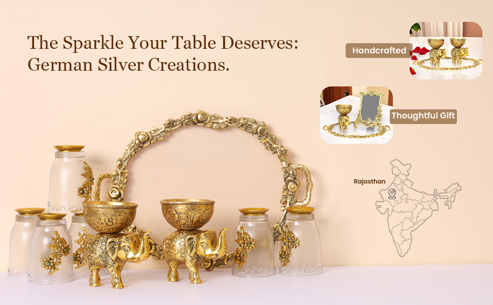 Gold tableware set with decorative elements on a beige background, featuring text about German silver creations.