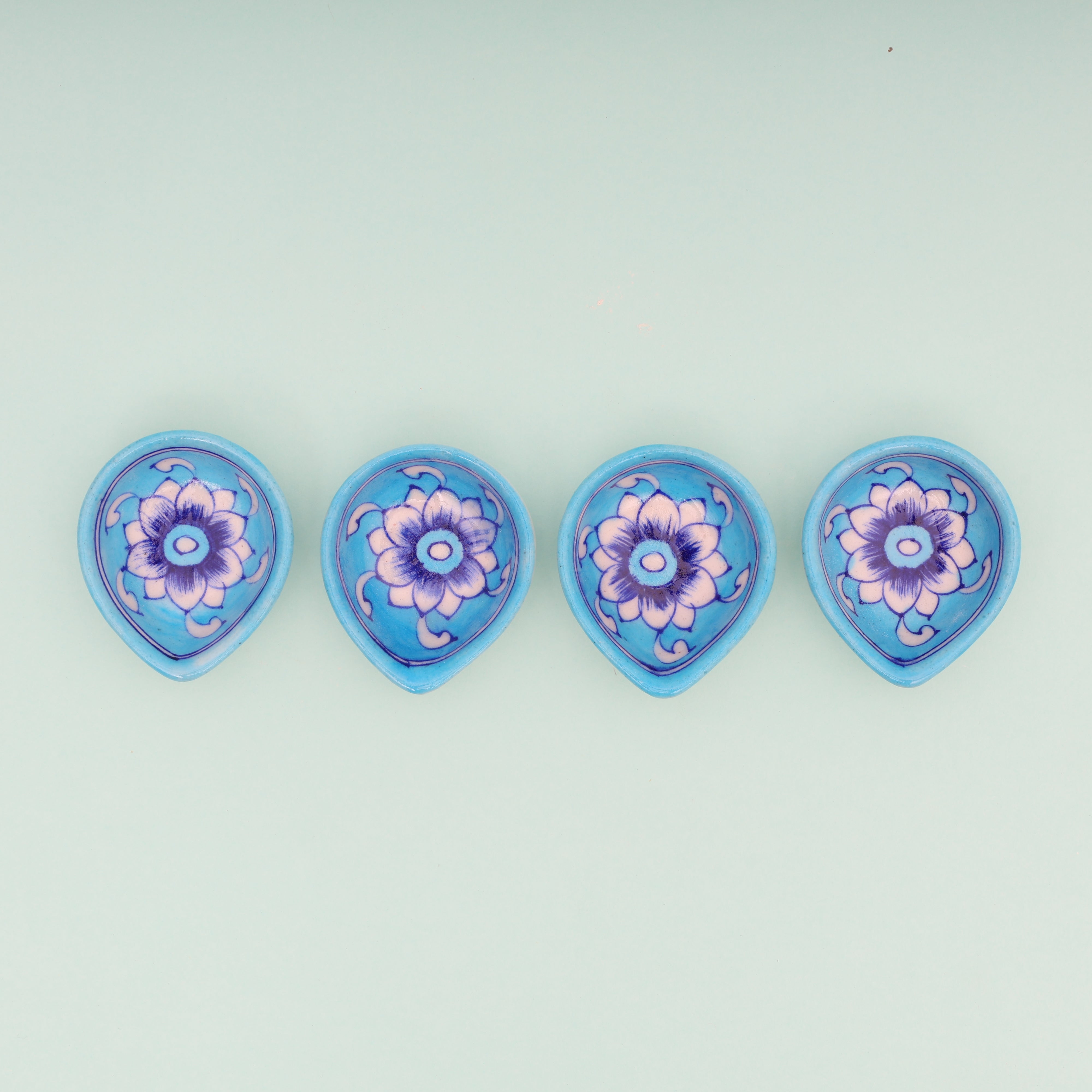 Handcrafted Sky Blue Blue Pottery Diyas  Set - Floral Design