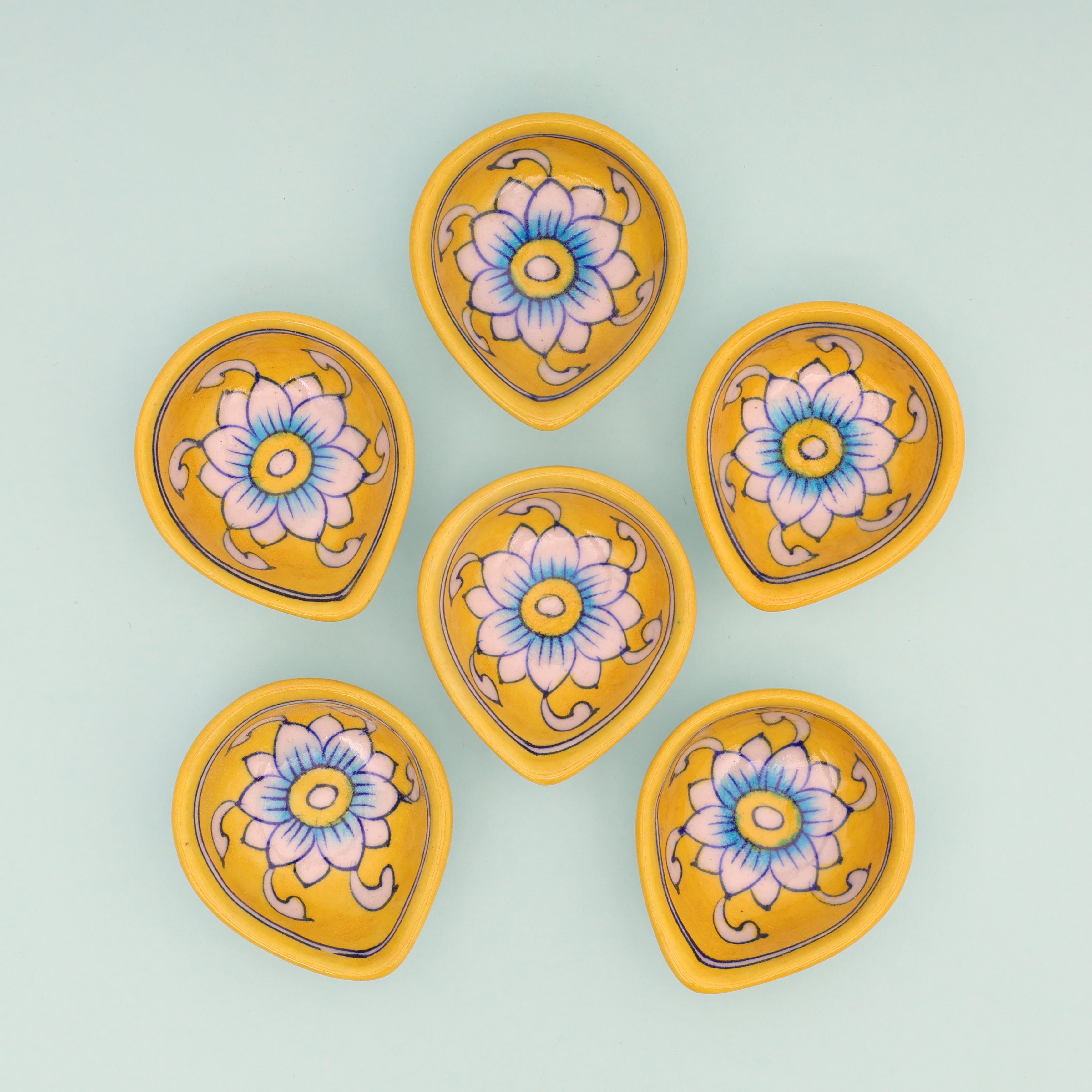 Handcrafted Yellow Leaf-Shaped Blue Pottery Diyas Set