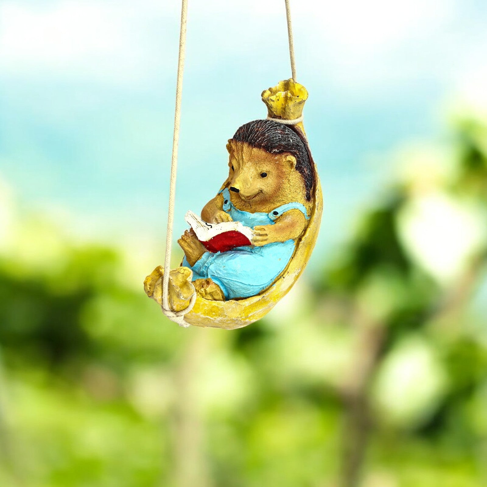Hanging Hedgehog reader on a swing