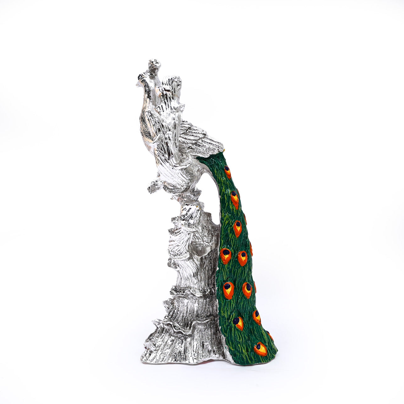 Silver-plated Peacock sitting on the branch