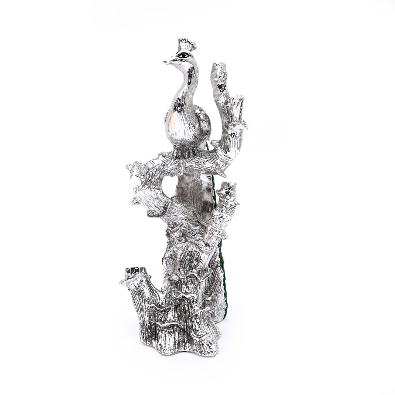 Silver-plated Peacock sitting on the branch